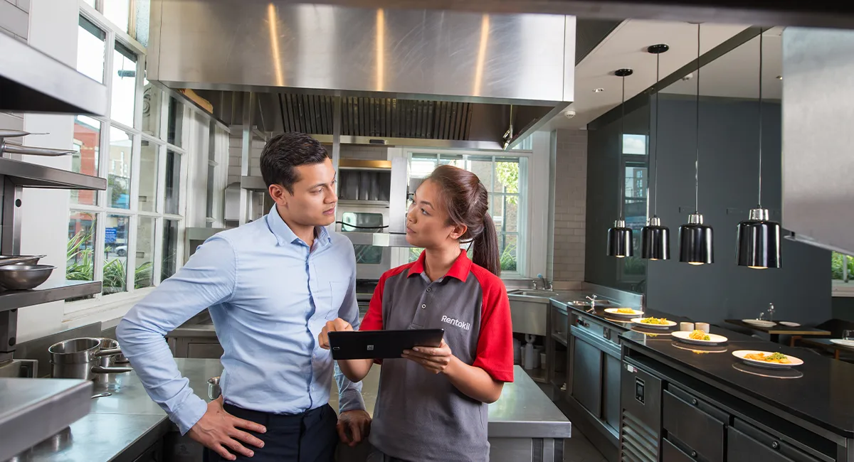 Rentokil technician with a restaurant customer