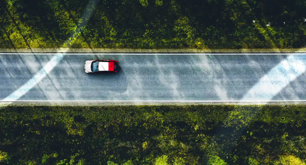 Car driving along a road